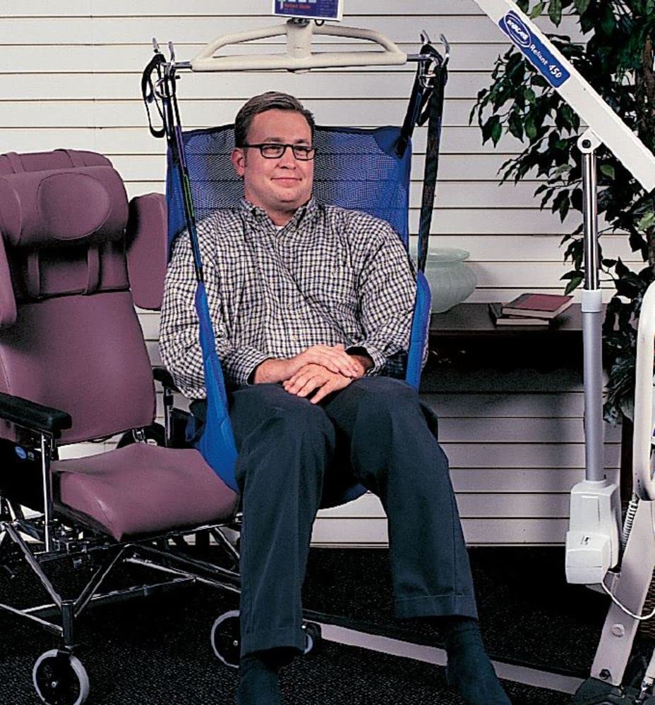 A male sitting in an Invacare Reliant full-body sling.