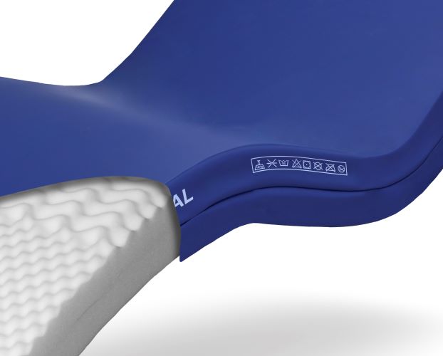 A close-up image of a blue mattress cover on a foam mattress. The image is on a white background.